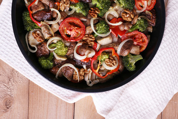 Braised wild mushrooms with vegetables and spices in pan