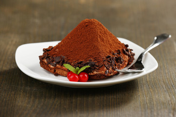 Yummy chocolate cupcake on table