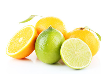 Fresh juicy limes and oranges isolated on white