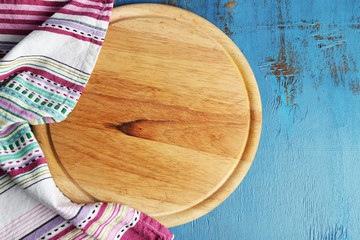 Empty cutting board on wooden background