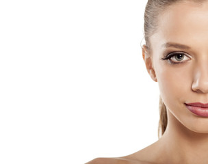 Fototapeta premium half face of smiling beautiful blonde with false eyelashes