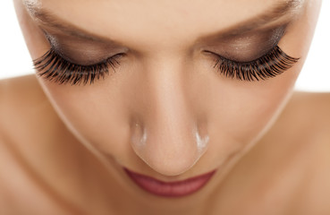 close up of eyes with long artificial eyelashes