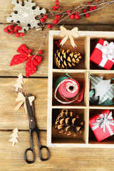 Beautiful Christmas composition with gifts in wooden crate