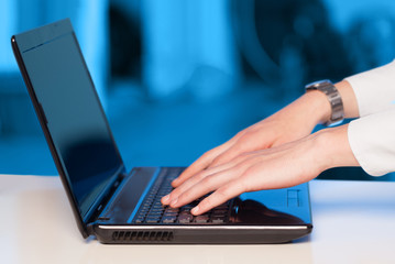 Fototapeta na wymiar Businessman pressing modern laptop computer on colorful backgrou