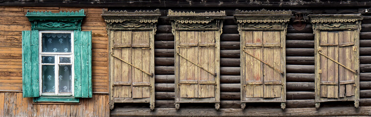 Wooden window with shutter doors.