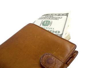 Old brown wallet with money on white background
