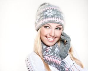 Beauty winter girl wearing hat and scarf