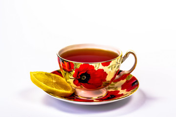 red cup of tea with lemon