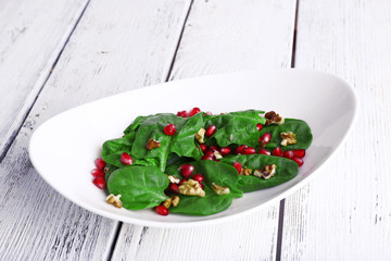 Fresh salad with greens, garnet and spices