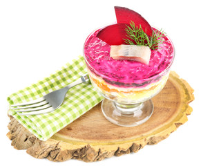 Russian herring salad in glass bowl,