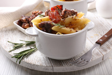 Tasty pasta with meat in ceramic pot