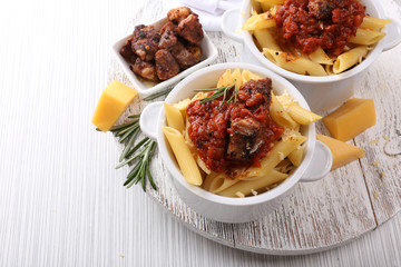 Tasty pasta with meat in ceramic pot