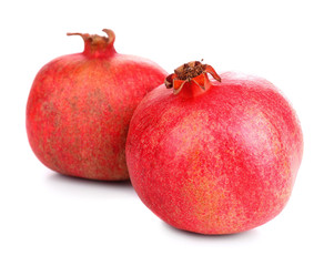 Juicy ripe pomegranates, isolated on white