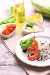 Boiled rice with shrimps served on table, close-up
