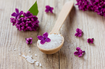 Spa composition with sea salt bath and lilac flowers
