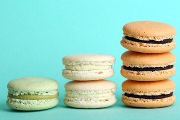 Gentle colorful macaroons on color background