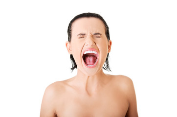 Portrait of nude woman screaming loud