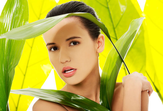 Fototapeta Portrait of nude woman with green leaves