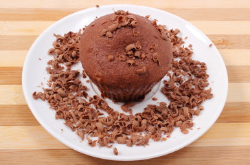Fresh baked muffin with grated chocolate