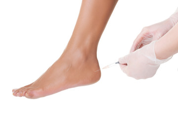 Woman getting a foot injection
