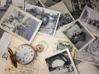Deurstickers pocket watch with old photographs © davehanlon