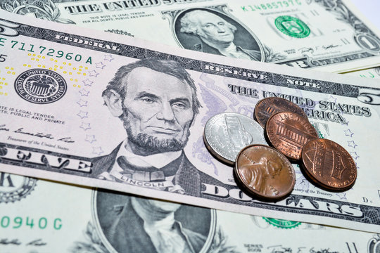 Dollar bills with coins