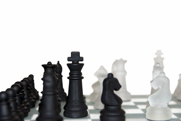 many chess pieces isolated against white
