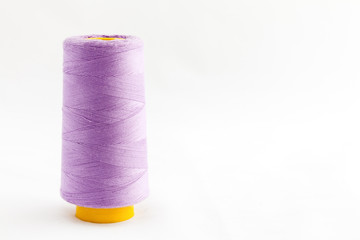 Spool of thread isolated on white background