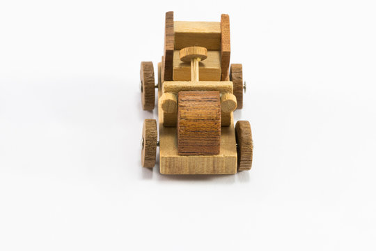 Wooden toy car miniature isolated on white background