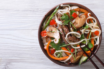 rice noodles with meat, vegetables and shiitake  top view