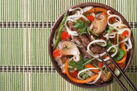Asian salad vegetables, meat, mushrooms and rice noodle