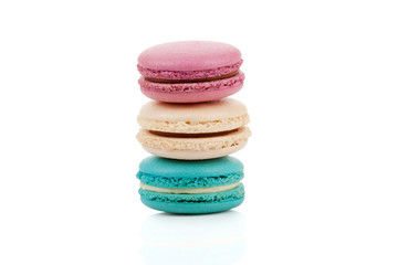 Three multicolored stacked macaroons isolated