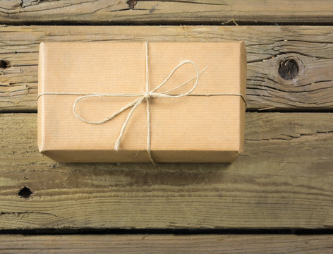 parcel wrapped in brown paper and string