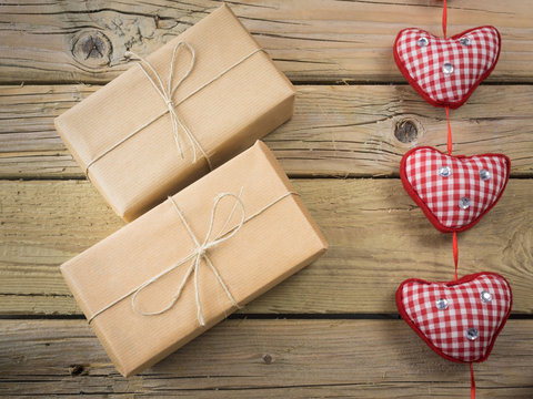 parcels  wrapped in brown paper and string with hearts