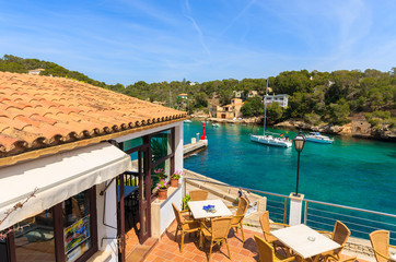 Fototapeta premium Restaurant terrace with sea view in Cala Figuera, Majorca island