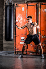 Obraz na płótnie Canvas Young man boxing workout