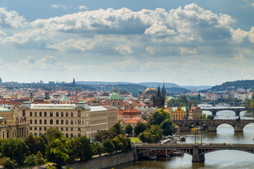 Fototapeta premium Bridge and rooftops of Prague