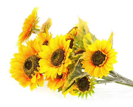 Composition of bright artificial sunflowers on white background.