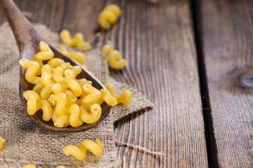 Pasta Curls on a wooden spoon