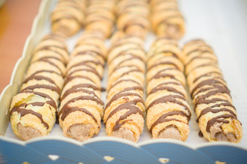 Bakery sticks with chocolate on shelf in supermarket