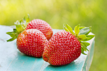 strawberries on wooden desk