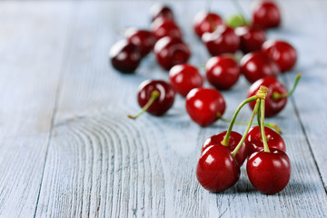 Fototapeta na wymiar fresh cherries on old wooden table