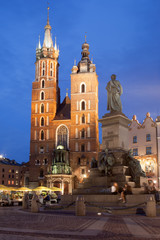 Fototapeta na wymiar St Mary Basilica and Adam Mickiewicz Monument at Night in Krakow
