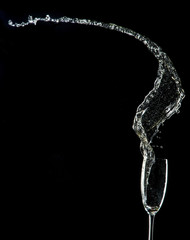 Champagne flutes on black background
