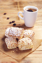 Sweet puff cookies with nuts and coffee