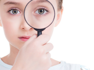 Close-up portrait of  little girl looking through a magnifying g