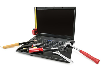 Computer repair with set of tools over white