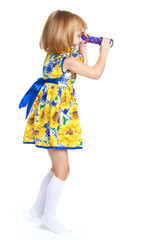 Fototapeta na wymiar Charming girl in a bright dress.