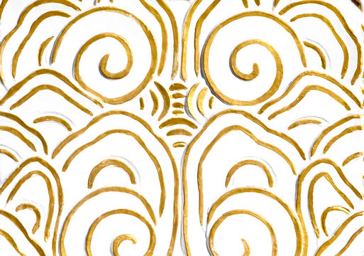 an ancient gold ornament on a white background