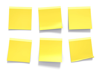 Set of yellow sticky notes used in an office for reminders